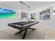 Game room with pool table, large TV, and ocean views at 780 Eldorado Ave, Clearwater, FL 33767