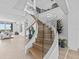 Modern curved staircase with glass and wooden accents at 780 Eldorado Ave, Clearwater, FL 33767