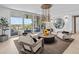 Light-filled living area featuring comfortable seating and access to an oceanfront patio at 780 Eldorado Ave, Clearwater, FL 33767