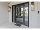 Modern glass front door with sidelights and a sleek design at 780 Eldorado Ave, Clearwater, FL 33767