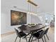 Elegant dining room with a statement light fixture at 780 Eldorado Ave, Clearwater, FL 33767