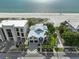 Luxury beachfront home with a metal roof and paver driveway at 780 Eldorado Ave, Clearwater, FL 33767