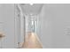 Hallway with light walls, wood floors and doors to other rooms at 780 Eldorado Ave, Clearwater, FL 33767