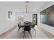 Modern dining room with large artwork and light wood floors at 780 Eldorado Ave, Clearwater, FL 33767