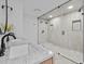 Modern bathroom with double vanity, marble countertops, and large walk-in shower at 780 Eldorado Ave, Clearwater, FL 33767