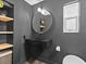 Modern bathroom with floating vanity and large mirror at 780 Eldorado Ave, Clearwater, FL 33767