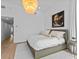 Bright bedroom with king bed, hardwood floors, and access to hallway at 780 Eldorado Ave, Clearwater, FL 33767