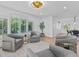 Bright sitting area with gray armchairs and window seat at 780 Eldorado Ave, Clearwater, FL 33767