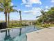 Relaxing pool area with ocean view and lounge chairs at 780 Eldorado Ave, Clearwater, FL 33767