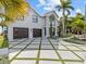 Two story home with landscaped yard and driveway at 780 Eldorado Ave, Clearwater, FL 33767