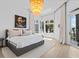 Spacious bedroom with ocean views, featuring a king-size bed and large windows at 780 Eldorado Ave, Clearwater, FL 33767