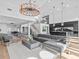 Open concept living room with sectional sofa and kitchen views at 780 Eldorado Ave, Clearwater, FL 33767