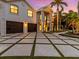 Two-car garage and a paved driveway with grass accents at 780 Eldorado Ave, Clearwater, FL 33767