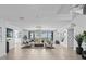 Living room with ocean view, stylish seating, and chandelier at 780 Eldorado Ave, Clearwater, FL 33767