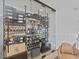 Custom-built glass enclosed wine cellar with ample storage at 780 Eldorado Ave, Clearwater, FL 33767