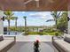 Beachfront backyard oasis with a pool, lounge area and ocean views at 780 Eldorado Ave, Clearwater, FL 33767