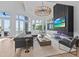 Spacious living area features a fireplace, large windows, and comfortable seating at 780 Eldorado Ave, Clearwater, FL 33767