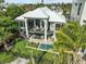 Luxury beachfront home with private pool and lush landscaping at 780 Eldorado Ave, Clearwater, FL 33767