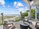 Private balcony overlooking the beach with comfortable seating at 780 Eldorado Ave, Clearwater, FL 33767