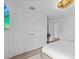Bright bedroom with double doors leading to closet and ensuite at 780 Eldorado Ave, Clearwater, FL 33767