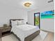 Spacious bedroom with a comfortable bed, and plenty of natural light at 780 Eldorado Ave, Clearwater, FL 33767