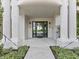 Elegant entry with columns and modern glass door at 780 Eldorado Ave, Clearwater, FL 33767