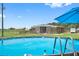 Refreshing above ground pool with barn in the background at 8602 State Road 674, Wimauma, FL 33598