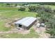 Large barn with multiple stalls and a fenced area at 8602 State Road 674, Wimauma, FL 33598