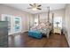 Spacious main bedroom with a large four poster bed at 8602 State Road 674, Wimauma, FL 33598