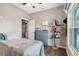 Charming bedroom with large windows and a patchwork quilt at 8602 State Road 674, Wimauma, FL 33598