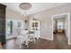 Charming dining area with a rustic table and chairs at 8602 State Road 674, Wimauma, FL 33598