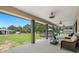 Spacious covered back porch with ceiling fans at 8602 State Road 674, Wimauma, FL 33598
