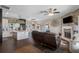 Open kitchen with island, stainless steel appliances, and custom cabinetry at 8602 State Road 674, Wimauma, FL 33598