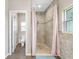 Bathroom with walk-in shower and tile flooring at 8602 State Road 674, Wimauma, FL 33598