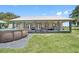 Home with covered porch and above ground pool at 8602 State Road 674, Wimauma, FL 33598