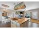 Kitchen features a butcher block island and a view of the living room at 8602 State Road 674, Wimauma, FL 33598