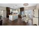 Modern kitchen with a kitchen island, breakfast nook, and stainless steel appliances at 8602 State Road 674, Wimauma, FL 33598