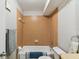 Simple bathroom featuring a tub, toilet, and light brown tile at 11812 Raintree Lake Ln # B, Tampa, FL 33617