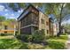 Two story condo building with a screened balcony at 11812 Raintree Lake Ln # B, Tampa, FL 33617