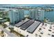 Aerial view showing building, parking and waterfront at 400 64Th Ave # 704, St Pete Beach, FL 33706