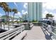 Shared waterfront deck with seating and boat slips at 400 64Th Ave # 704, St Pete Beach, FL 33706