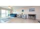 Bright living room featuring a sofa, armchairs, and a tiled floor at 400 64Th Ave # 704, St Pete Beach, FL 33706