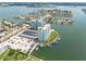 Aerial view of waterfront property with two towers and parking at 400 64Th Ave # 704, St Pete Beach, FL 33706