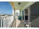 Spacious balcony with water view and seating at 400 64Th Ave # 704, St Pete Beach, FL 33706