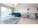 Living room with tiled floors, comfy seating, and water views at 400 64Th Ave # 704, St Pete Beach, FL 33706