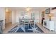 Bright dining area with table and chairs and access to kitchen at 400 64Th Ave # 704, St Pete Beach, FL 33706