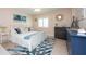 Spacious bedroom with a white bed frame and blue accents at 400 64Th Ave # 704, St Pete Beach, FL 33706