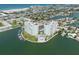 Aerial view of waterfront property with two towers and a pool at 400 64Th Ave # 704, St Pete Beach, FL 33706