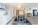 Charming dining area with table and chairs and built in hutch at 400 64Th Ave # 704, St Pete Beach, FL 33706