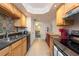 Open kitchen with stainless steel appliances and colorful tile at 400 64Th Ave # 704, St Pete Beach, FL 33706